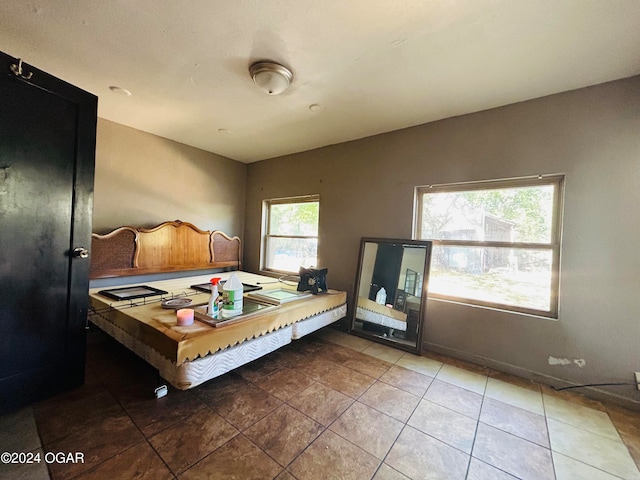 bedroom featuring light tile patterned flooring