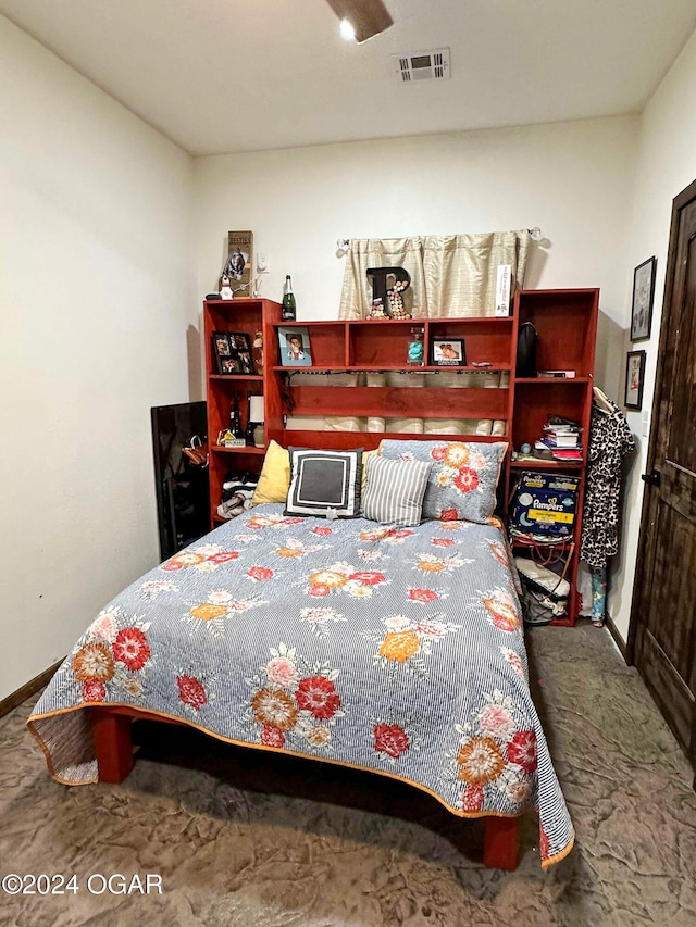 bedroom with baseboards and visible vents