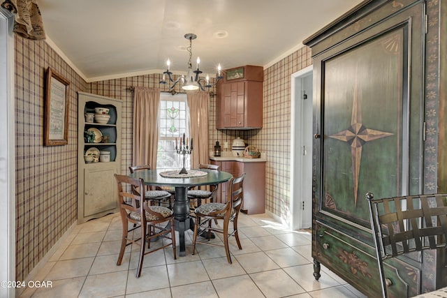 dining room featuring ornamental molding, light tile patterned floors, vaulted ceiling, and wallpapered walls