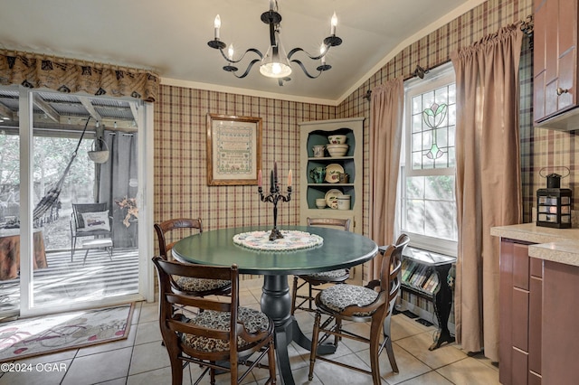 dining space with lofted ceiling, wallpapered walls, light tile patterned floors, and a notable chandelier