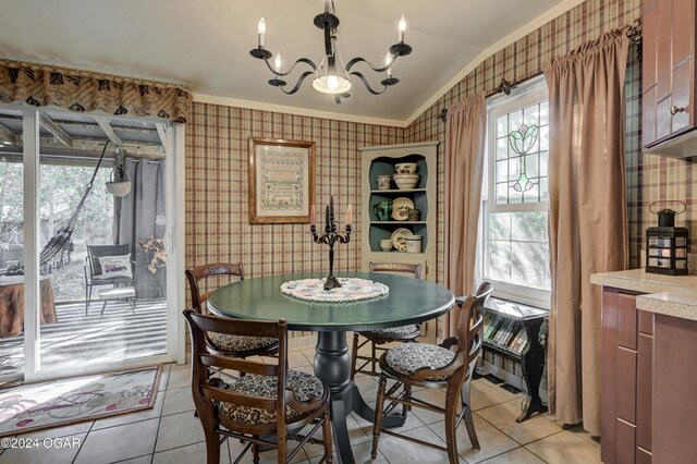 114 W F St, Joplin, MO 64801 - dining space with wallpapered walls, light tile patterned flooring, a chandelier, and lofted ceiling