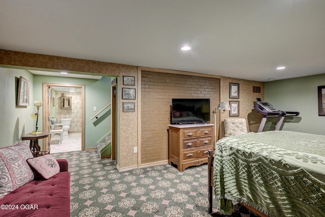 bedroom with recessed lighting, light carpet, connected bathroom, and baseboards