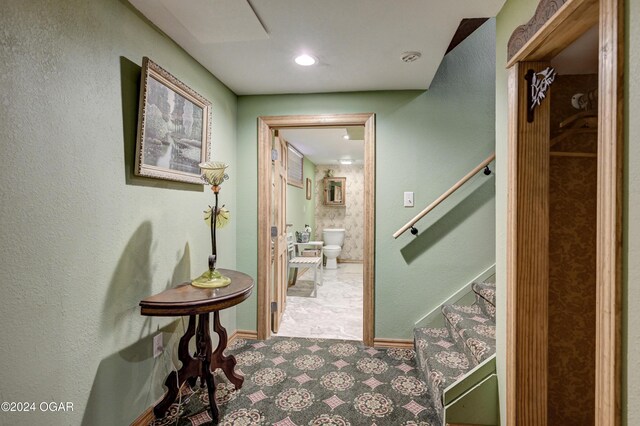 114 W F St, Joplin, MO 64801 - corridor with tile patterned floors, stairway, and baseboards