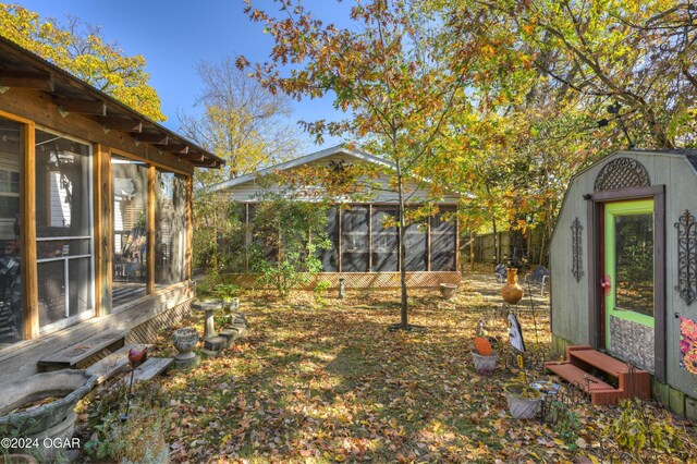 114 W F St, Joplin, MO 64801 - view of yard featuring a sunroom and entry steps