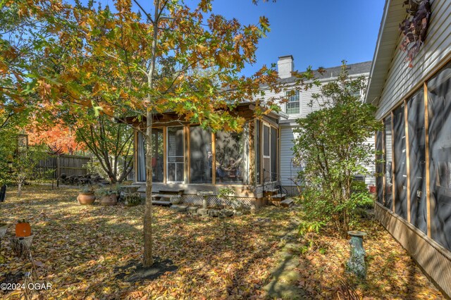 114 W F St, Joplin, MO 64801 - view of yard with a sunroom and fence