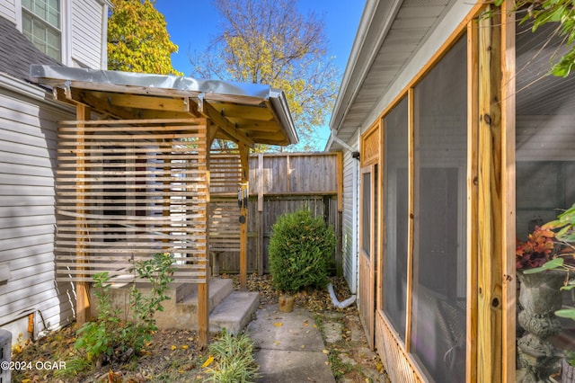 doorway to property with fence