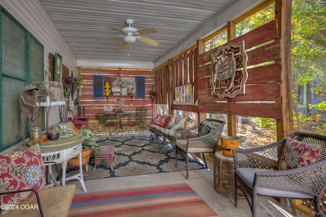 sunroom with a ceiling fan