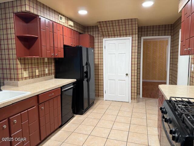 kitchen with light tile patterned floors, black appliances, open shelves, and light countertops