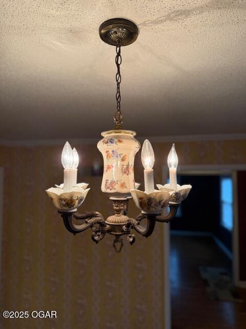 room details featuring ornamental molding and a textured ceiling