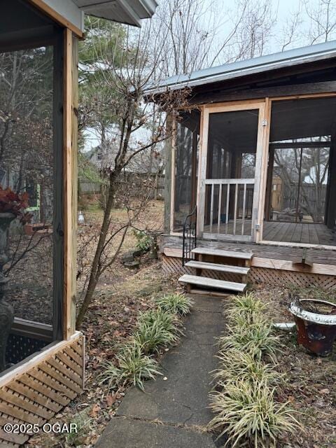 view of side of home with a sunroom