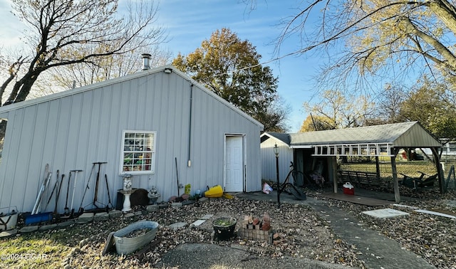 view of outbuilding featuring a carport