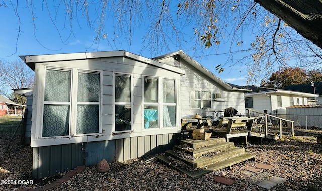 view of home's exterior featuring a deck