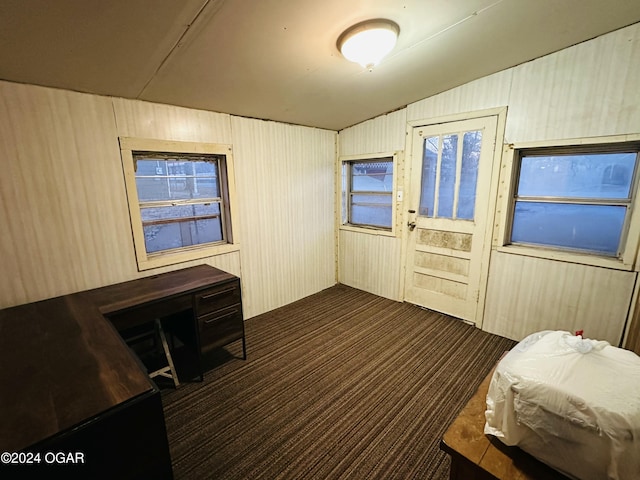 carpeted bedroom featuring lofted ceiling