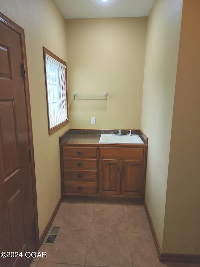 bathroom with vanity and tile patterned floors