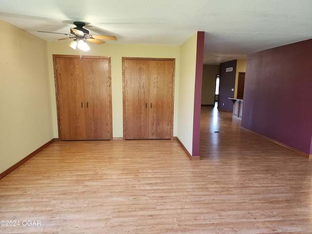 interior space featuring light wood-type flooring and ceiling fan