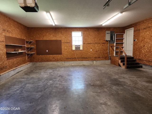 garage featuring a garage door opener and cooling unit