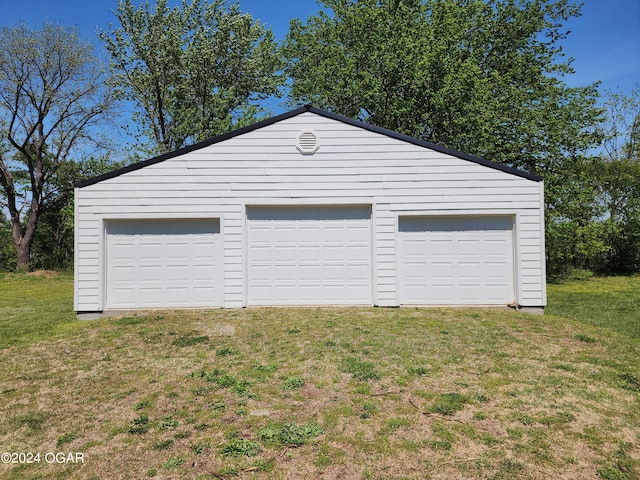 garage with a lawn