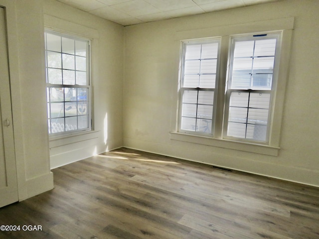 912 Chestnut Ave, Joplin, MO 64801 - spare room featuring dark wood-style flooring and baseboards