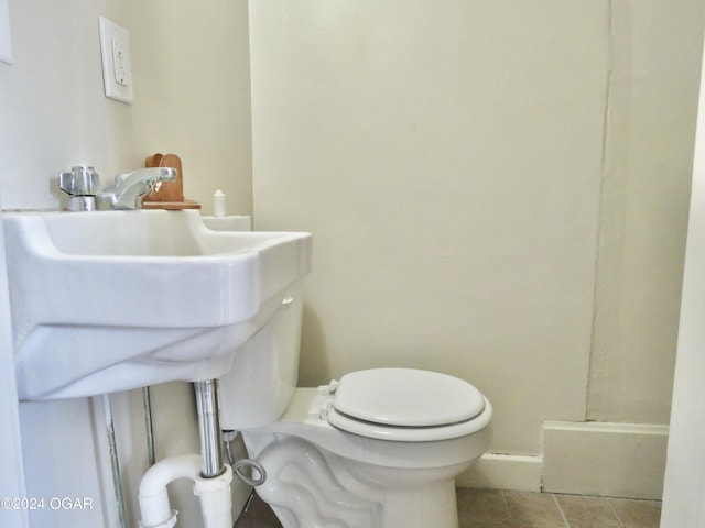912 Chestnut Ave, Joplin, MO 64801 - bathroom featuring toilet and tile patterned flooring