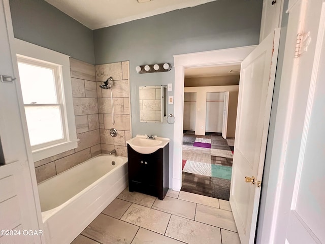 bathroom with vanity, tiled shower / bath, and hardwood / wood-style flooring