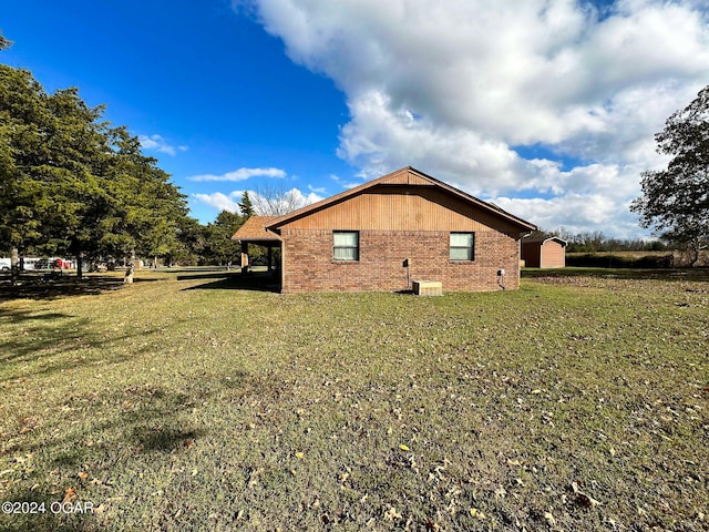 view of home's exterior with a lawn