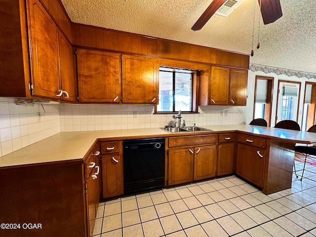 kitchen with kitchen peninsula, a textured ceiling, ceiling fan, sink, and dishwasher