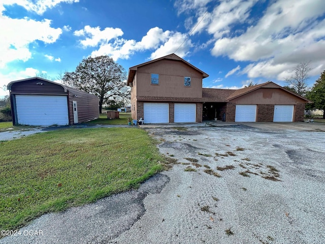 view of side of home featuring a lawn