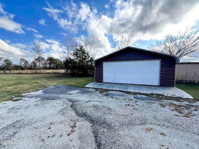 garage with a yard