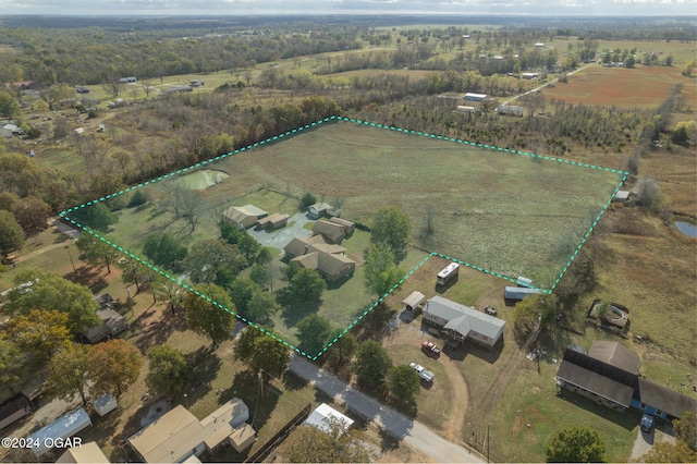 birds eye view of property with a rural view