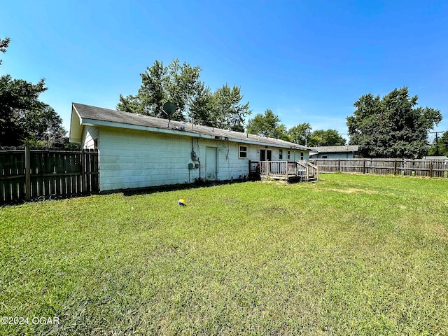 view of yard featuring a wooden deck