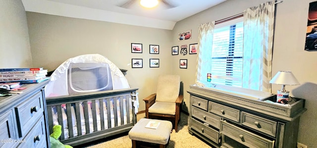 carpeted bedroom featuring vaulted ceiling and ceiling fan