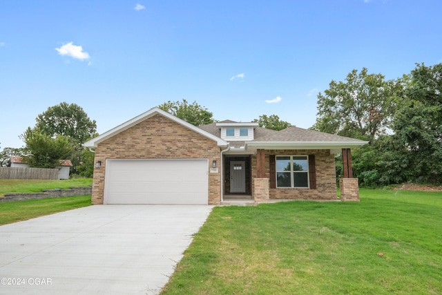 view of front facade featuring a garage and a front yard