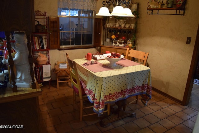 dining space with tile patterned floors