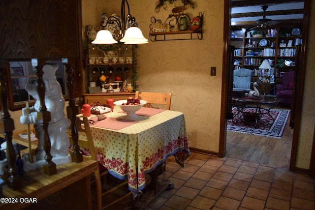 dining space with hardwood / wood-style flooring and ceiling fan