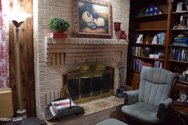 living area featuring a fireplace