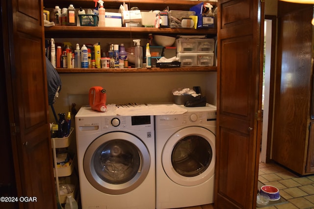 clothes washing area with tile patterned flooring and washing machine and clothes dryer