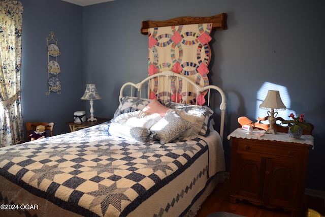 bedroom with wood-type flooring