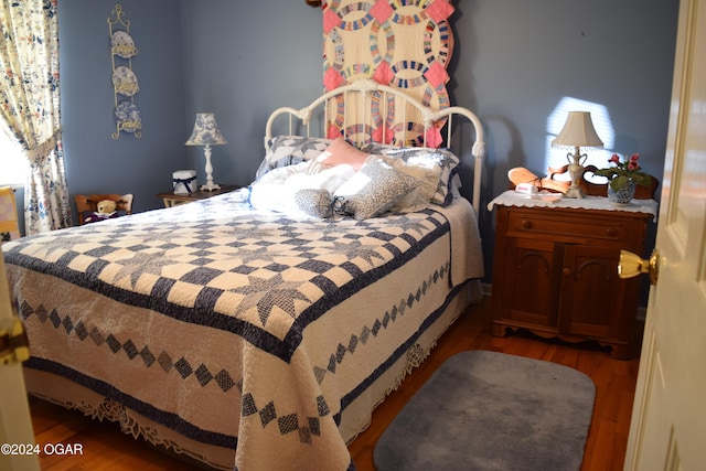 bedroom featuring wood-type flooring