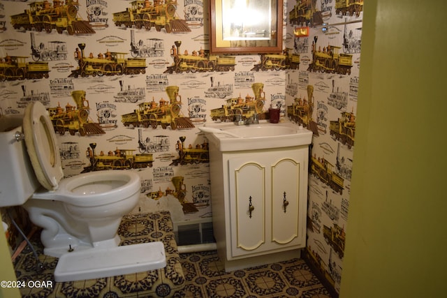 bathroom with vanity and toilet