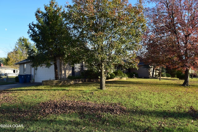 view of front of house with a garage and a front yard