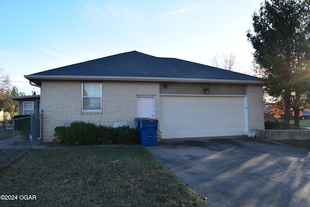 property exterior at dusk featuring a garage