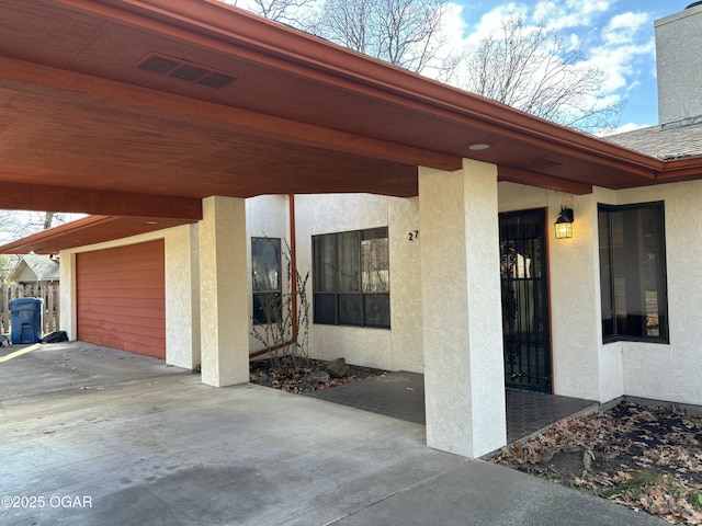 view of exterior entry featuring a garage