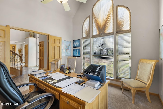 office with high vaulted ceiling, ceiling fan, and light tile patterned flooring