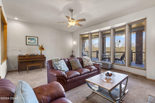 living room with ceiling fan and light carpet