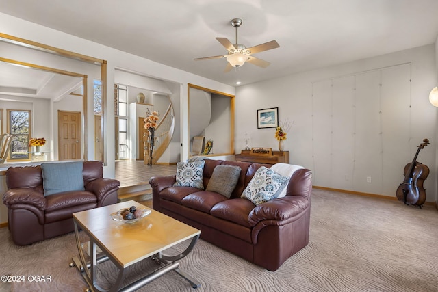 living room with ceiling fan and light carpet