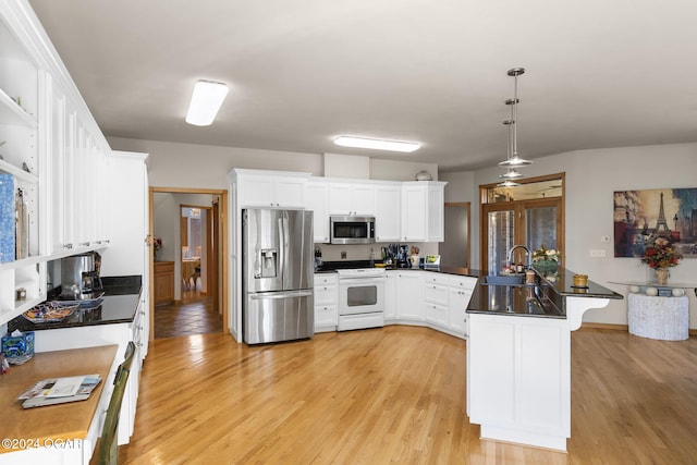 kitchen featuring white cabinetry, light hardwood / wood-style flooring, pendant lighting, and appliances with stainless steel finishes