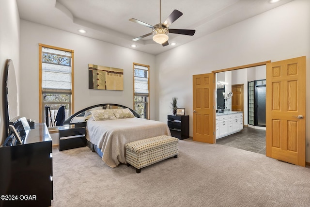 carpeted bedroom with a high ceiling and ceiling fan