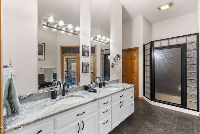 bathroom with vanity and walk in shower