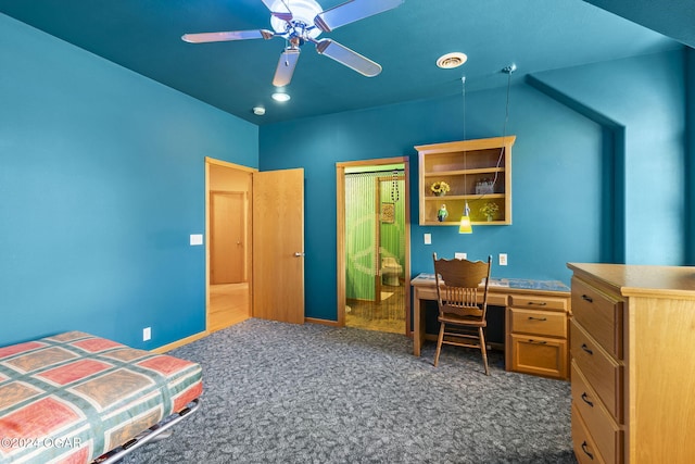 bedroom featuring ceiling fan, dark carpet, and lofted ceiling