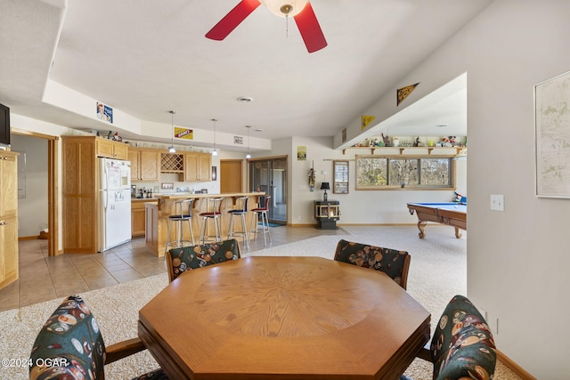 tiled dining space with ceiling fan and billiards